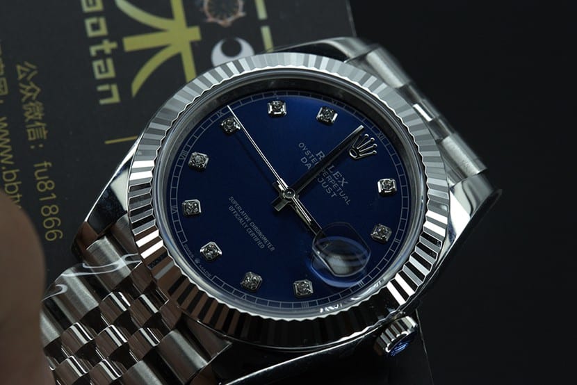 jvsRolex blue log watch tiger tooth ring