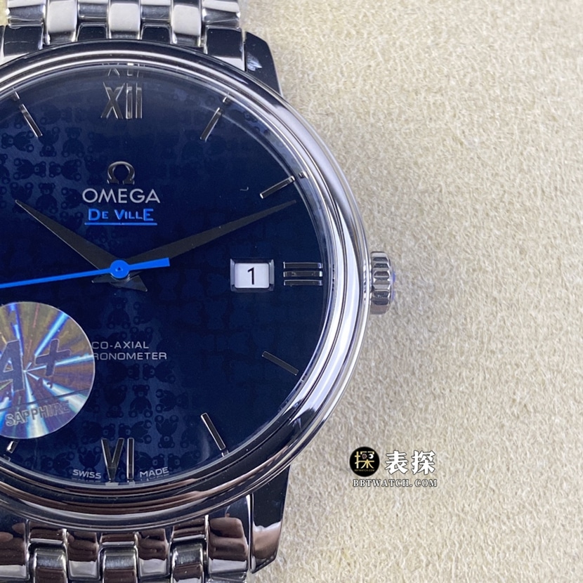 A+ factory Omega De Ville top-tier watch men's blue teddy bear pattern plate steel bracelet model pictures and prices front live photo