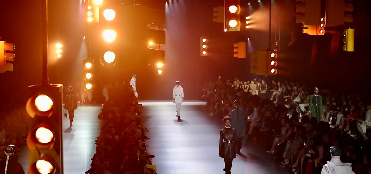 The scene for Herm&egrave;s RTW AW24 Part Two was set with somber, yellowed, cityscape lighting.