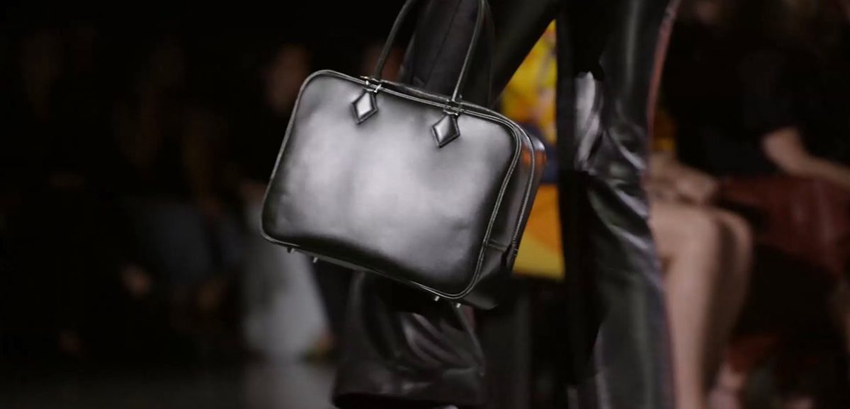 A Plume in Noir Boxcalf. Herm&egrave;s AW24 Look 53. Photo via Vogue.com. 