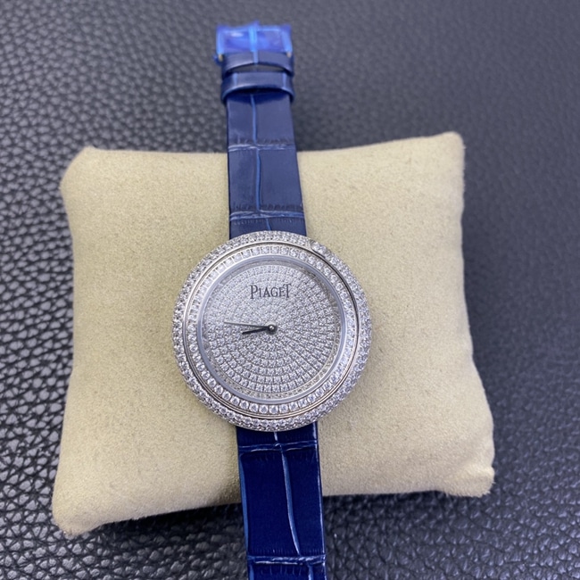 Piaget POSSESSION Diamond-Set Dial Rotating Bezel Women's Quartz Watch with White Dial and Blue Strap