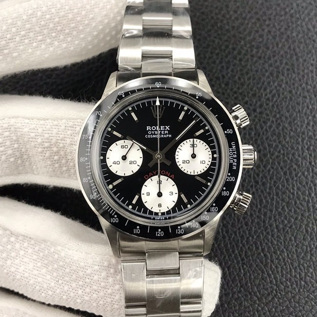Rolex Paul Newman vintage mechanical watch with retro elegance, black dial, and steel bracelet